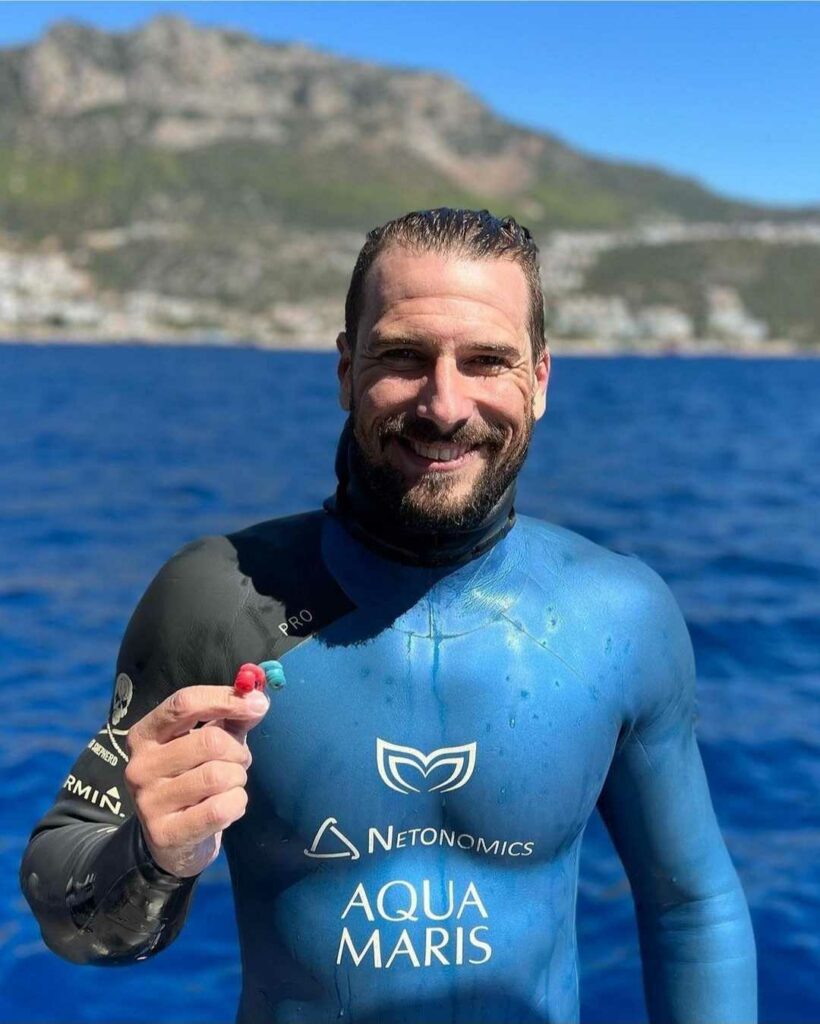 Famous freediver and scuba Diver Vitomir Maričić holding a pair of surfears