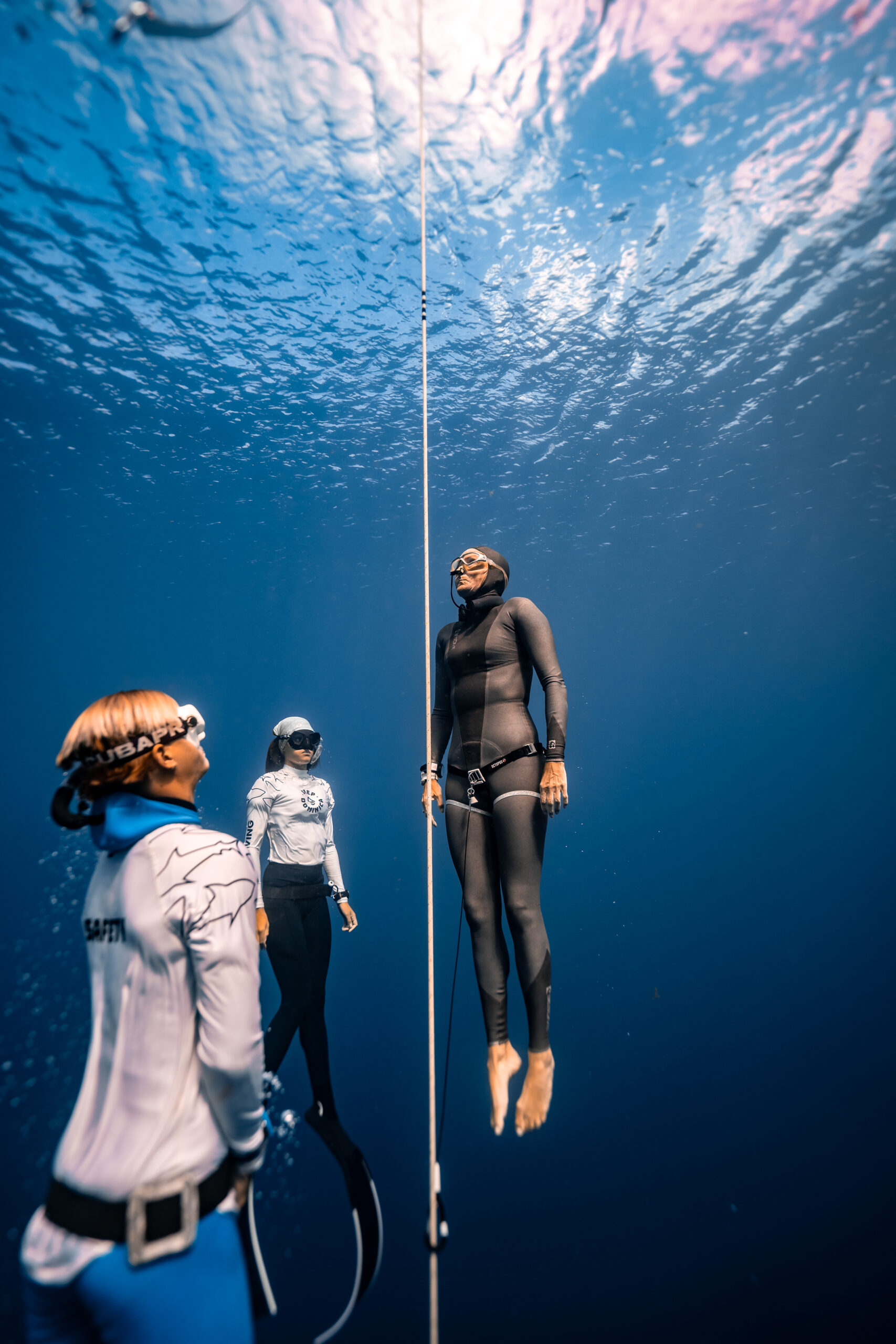 Diver using diving ear plugs from surfears