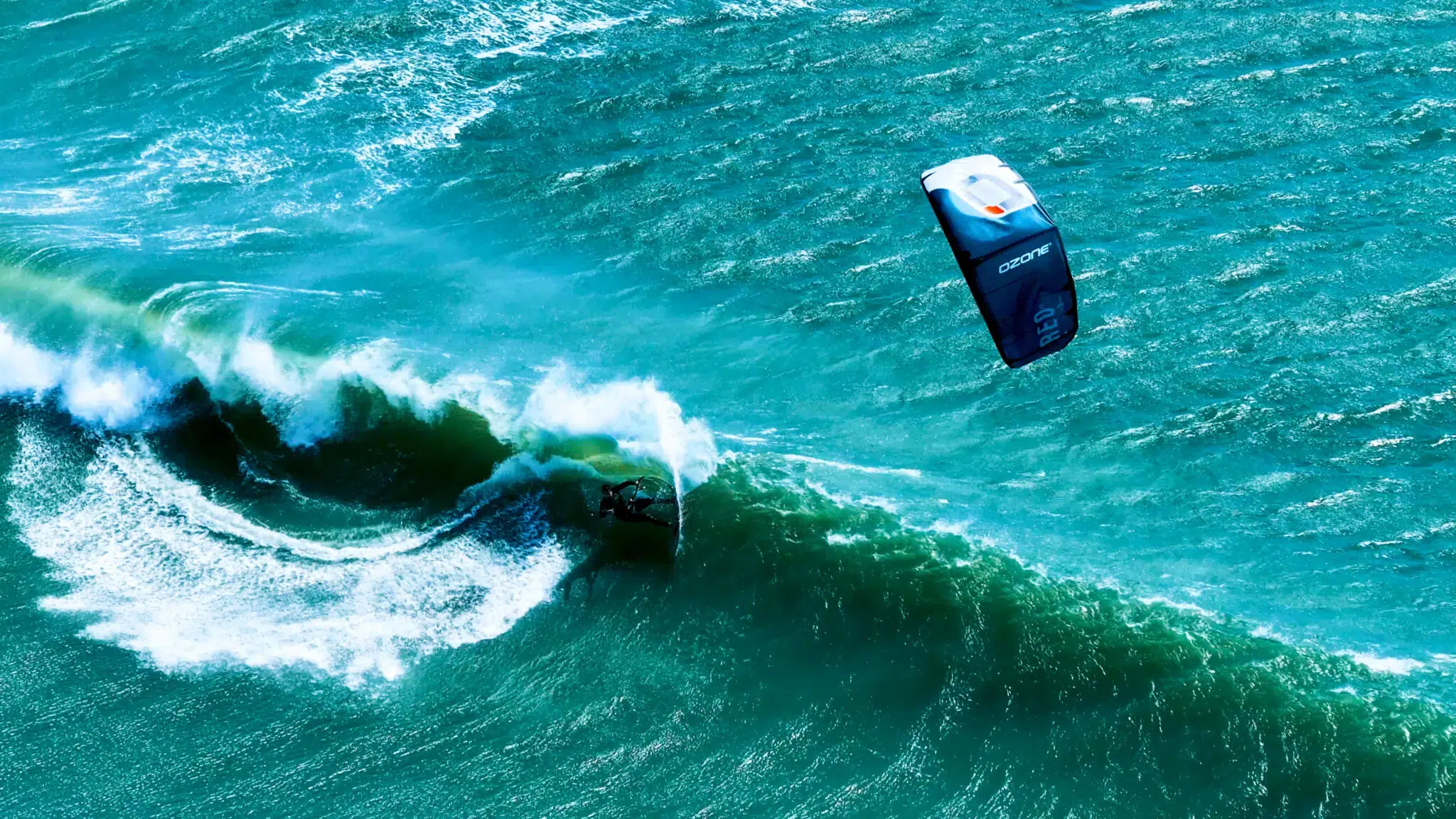 Kitesurfer wiping out at high speed into the water